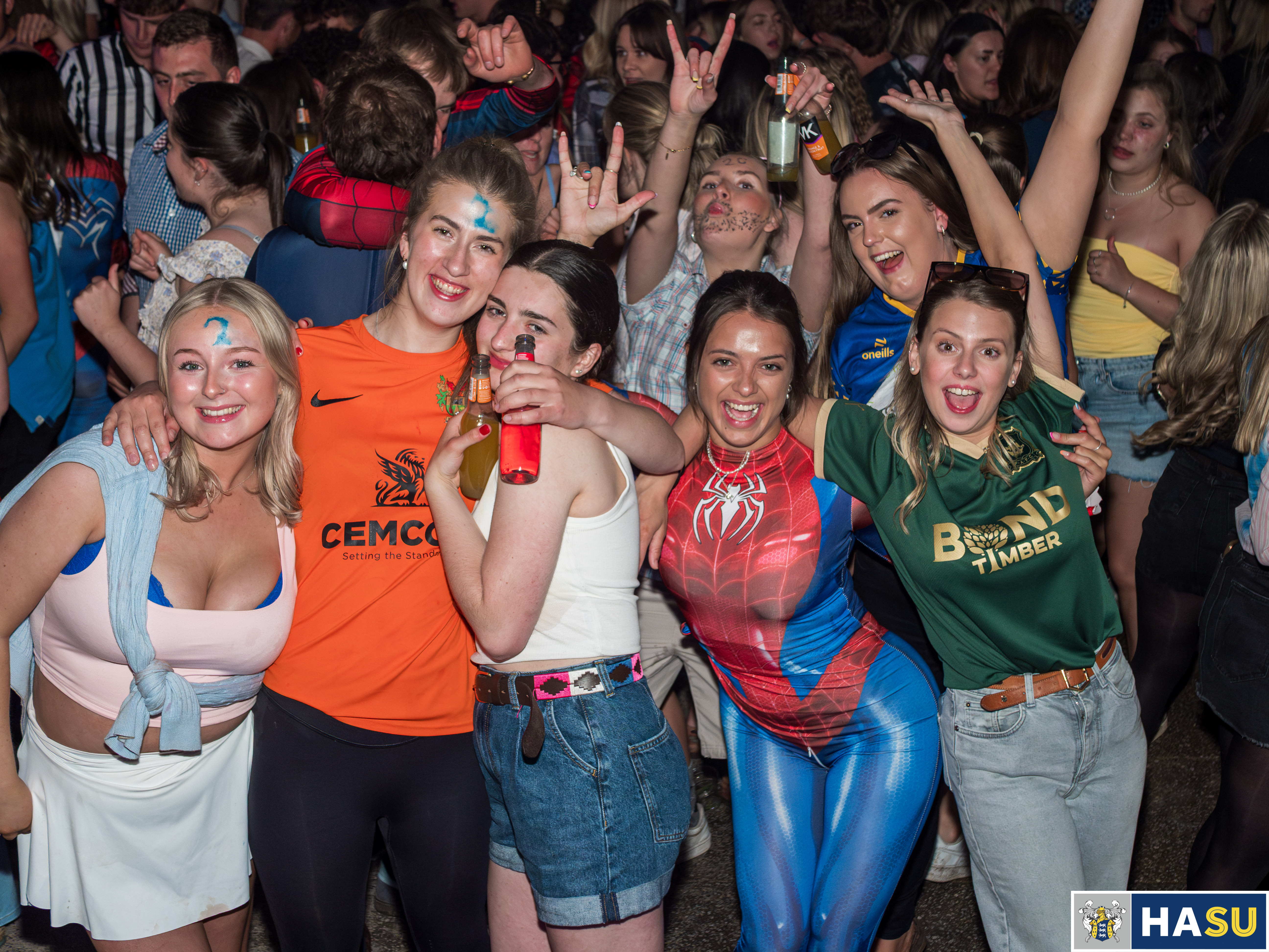 Group of mates in sport team jerseys at the Flock