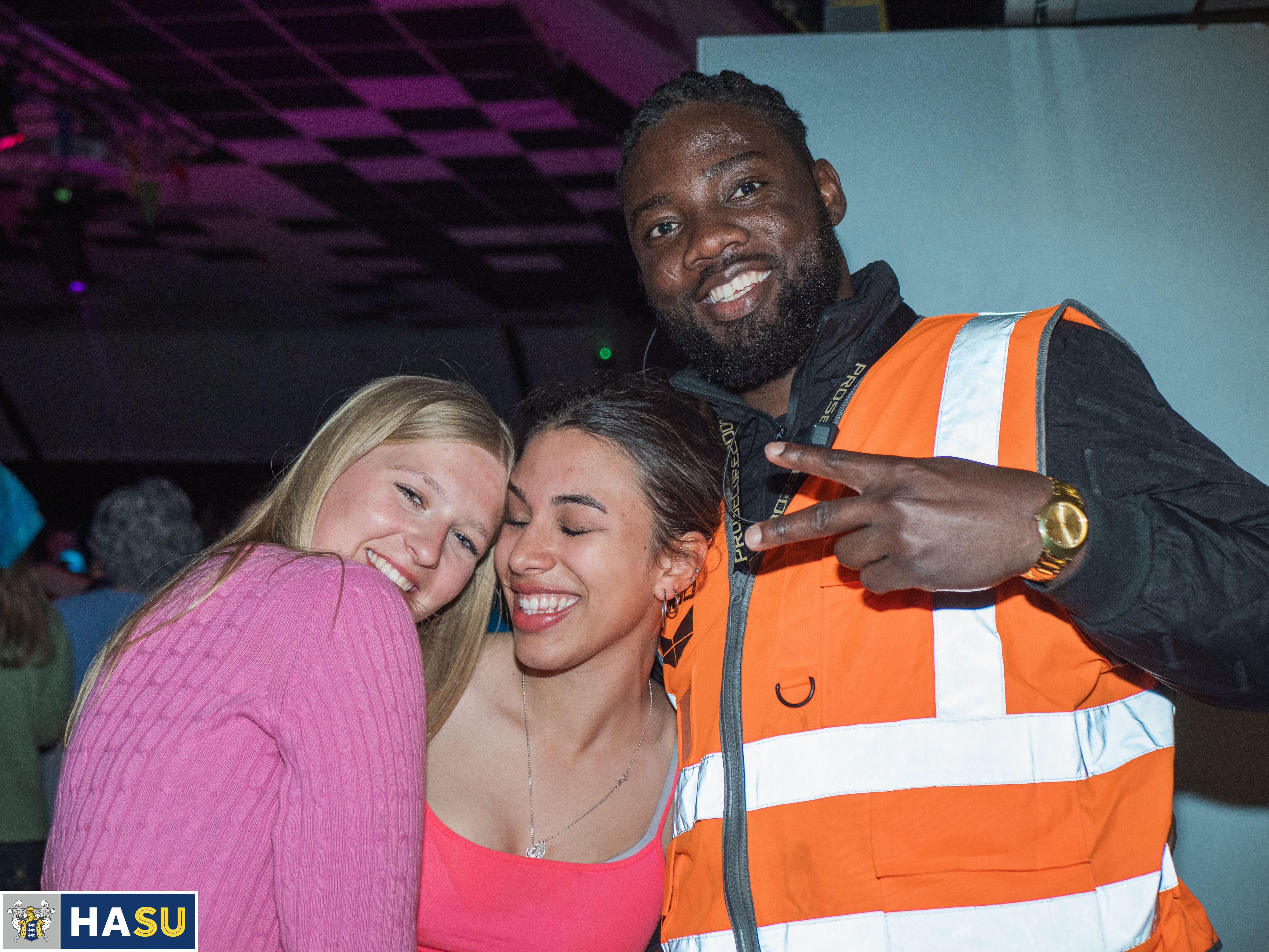 Prosecure team member with two student smiling and posing