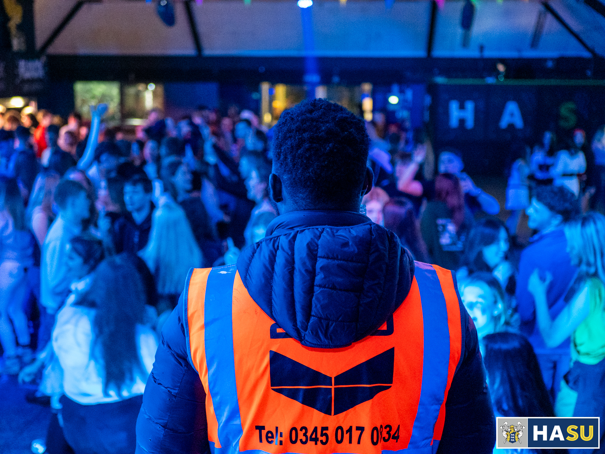 Team member standing on lookout at an event