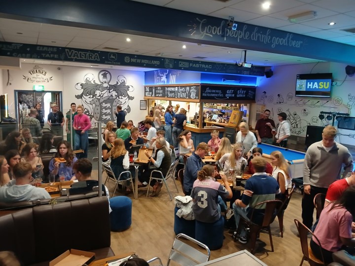 A packed out Welly Inn with students socialising